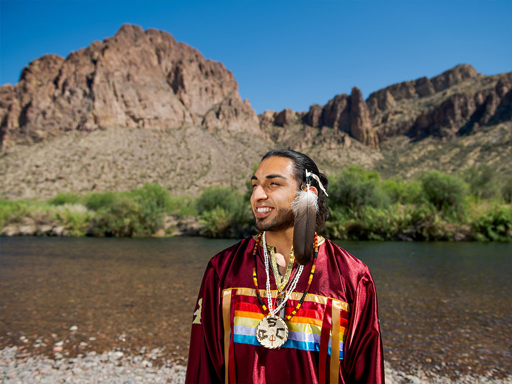 student near river in the desert